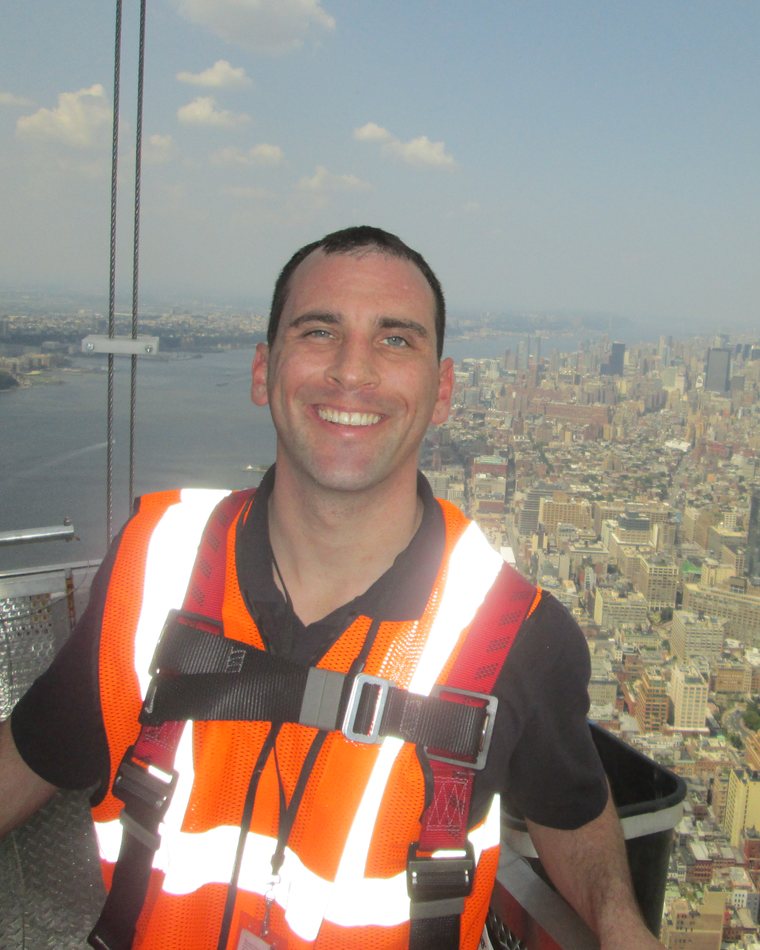 Michael Williams, P.E., on a suspended work platform above New York City